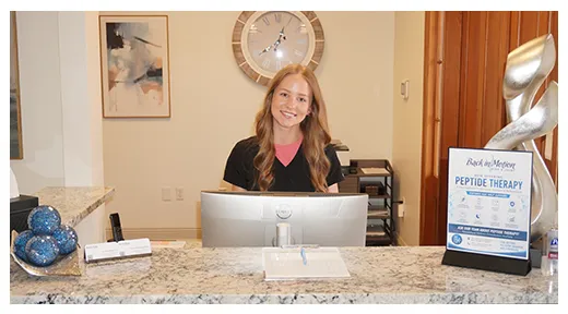 Chiropractic Baton Rouge LA Presley At Front Desk